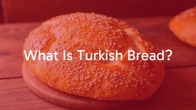 Freshly baked Turkish bread, golden brown crust with sesame seeds, soft and aromatic, rustic wooden table, warm lighting, realistic.