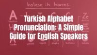 The Turkish alphabet written on a chalkboard with English pronunciation examples next to each letter, clean and educational, illustrative style.