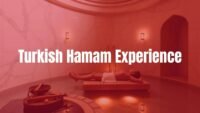 A serene Turkish Hamam interior with marble walls, warm steam, and soft lighting, featuring a person relaxing on a heated stone slab, traditional bathing tools nearby, peaceful and luxurious atmosphere, realistic.