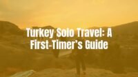 A solo traveler admiring the ancient ruins of Ephesus, warm sunset lighting, vibrant Turkish landscape, realistic and inviting.