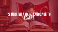 A person studying Turkish language books with a Turkish flag in the background, educational vibe, realistic.