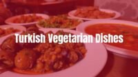 A colorful spread of Turkish vegetarian dishes, including stuffed grape leaves, lentil soup, and eggplant dishes, fresh herbs, rustic table setting, warm lighting, vibrant and inviting.
